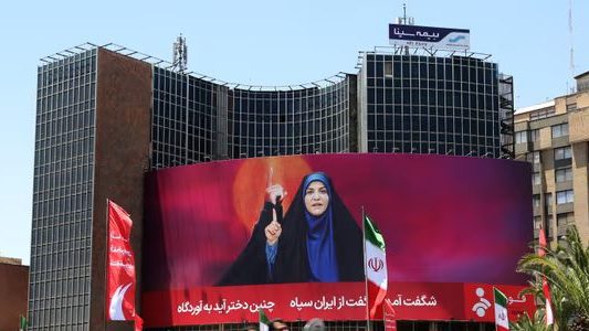 Iranian Presenter Sahar Emami Honored with Banner in Tehran After Surviving Israeli Strike on Live TV